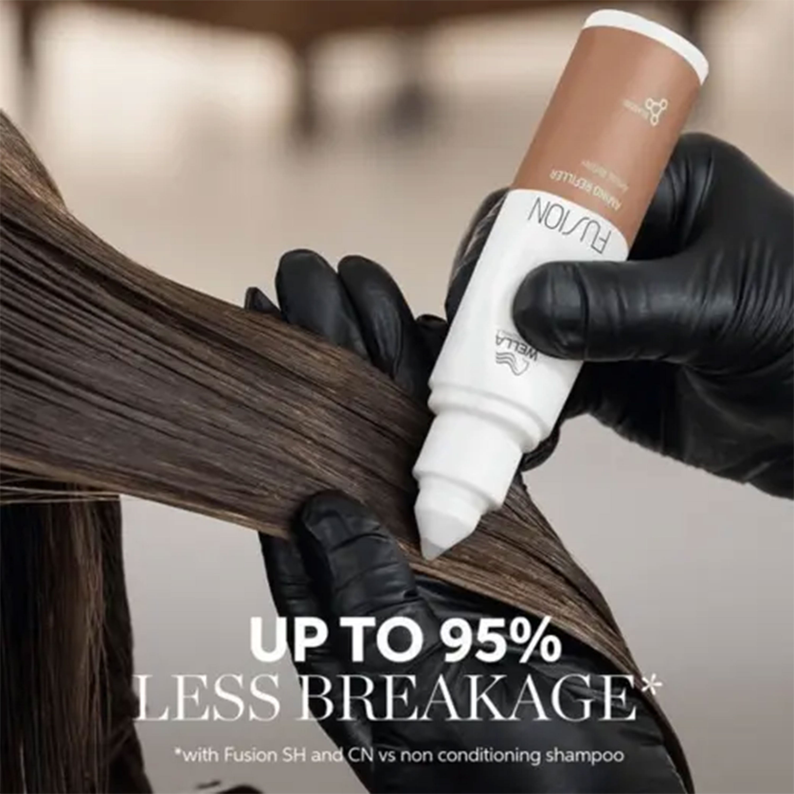 Person applying hair care product with text about reduced hair breakage