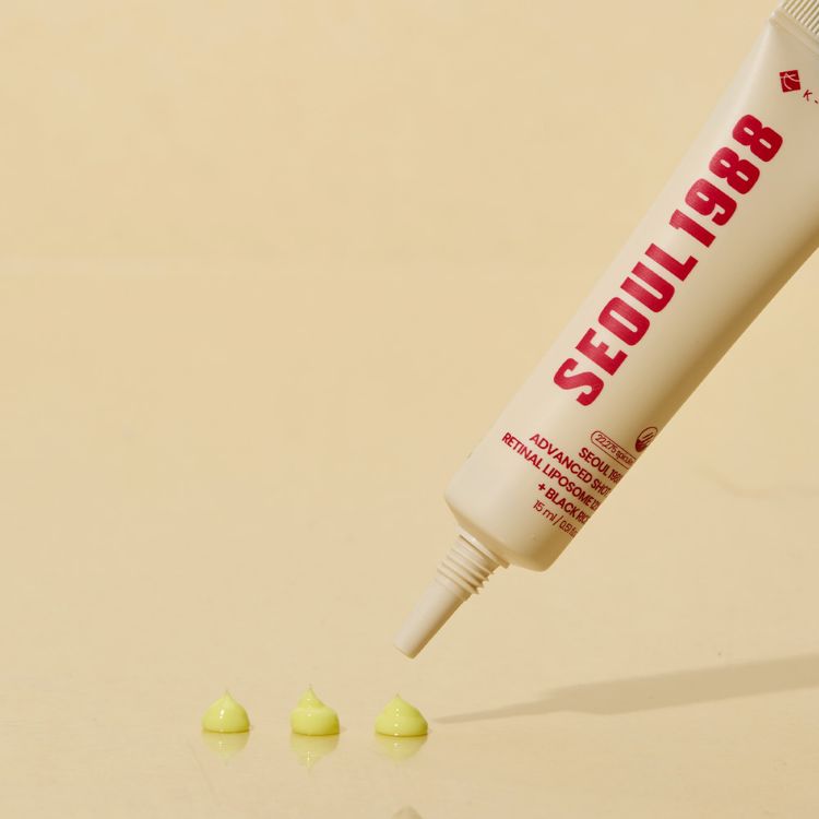 Seoul 1988 cosmetic tube with green product on a beige background