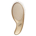 A gold-colored ergonomic paddle hairbrush designed for detangling, with the brand 'Olivia Garden' inscribed on the handle.