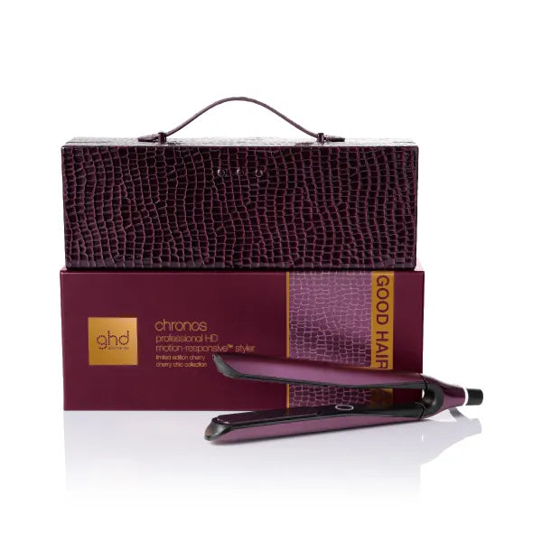 ghd hair straightener with packaging on a white background