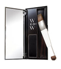 Makeup product with brush and mirror in a black case on a white background