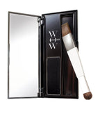Makeup product with brush and mirror in a black case on a white background