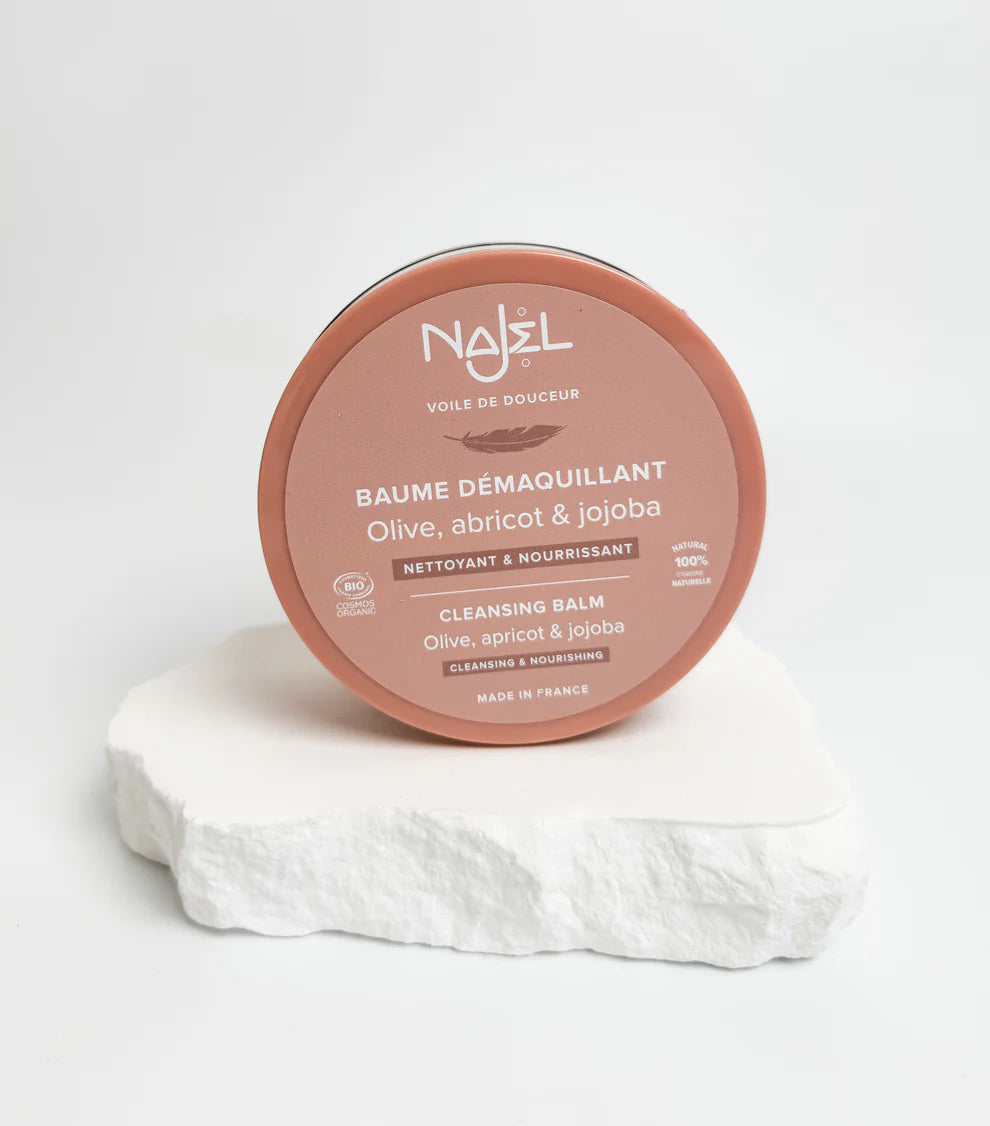 Cleansing balm container with 'Najel' branding on a white background