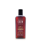 Red bottle of American Crew shampoo and conditioner on a white background
