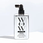 Bottle of Color Wow Extra Strength Dream Coat hair treatment on a light background