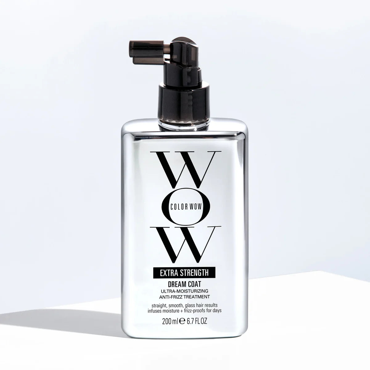 Bottle of Color Wow Extra Strength Dream Coat hair treatment on a light background