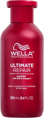 Red shampoo bottle labeled 'Wella Professionals Ultimate Repair' on a white background