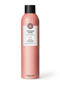 Pink hair spray bottle with black cap on a white background