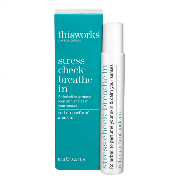 Rollerball and packaging of 'thisworks stress check breathe in' on a white background