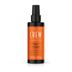 American Crew matte clay spray bottle on a white background