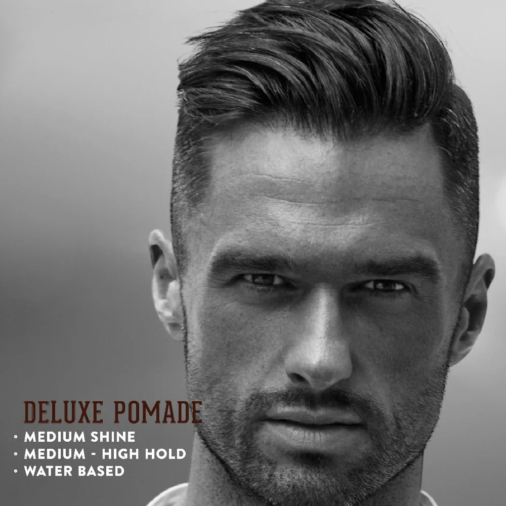 Man with styled hair against a gray background with text about Deluxe Pomade.
