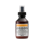 Bottle of Davines hair product on a white background