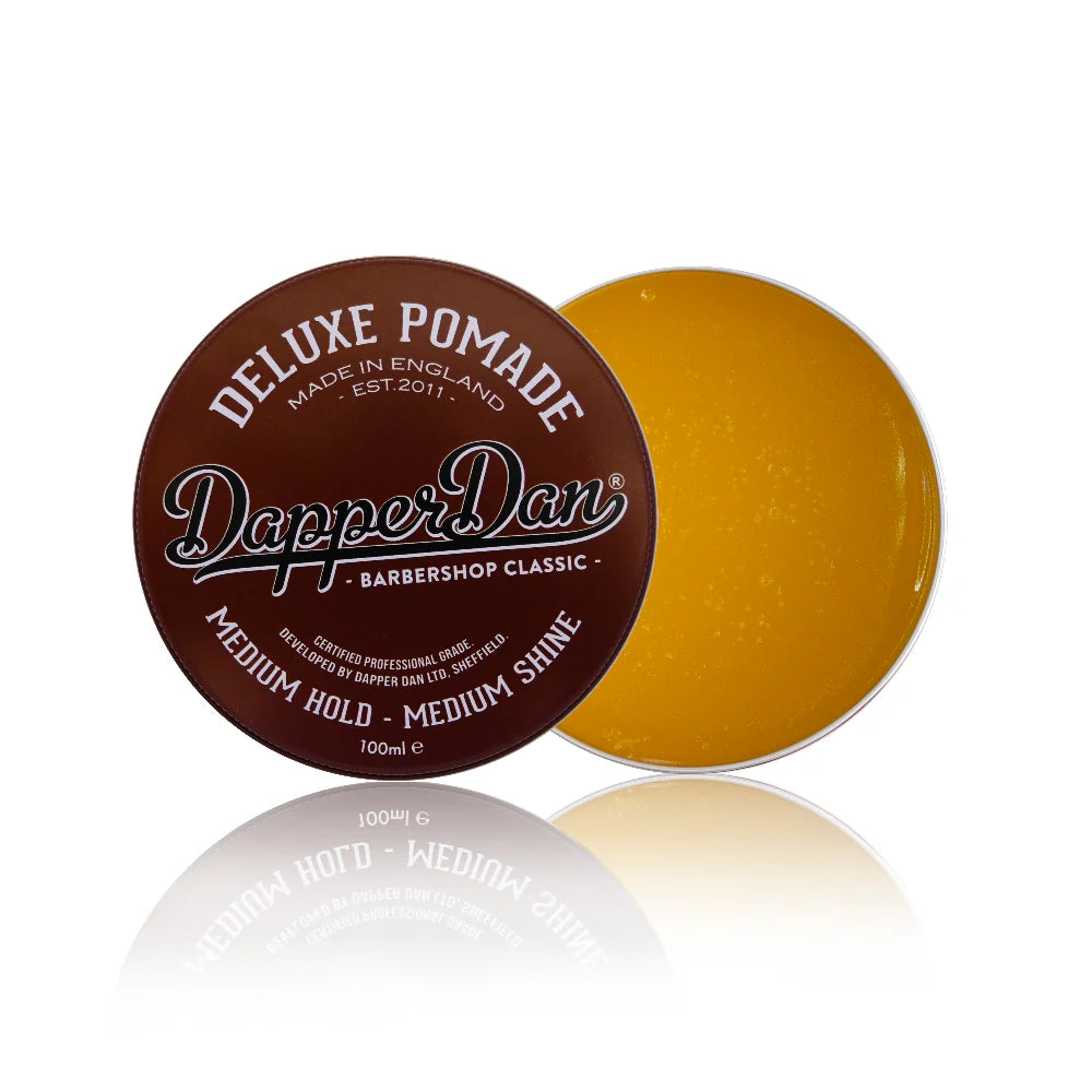Dapper Dan pomade container with brown lid and yellowish膏体 on a white background