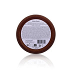 Round brown container with label on a white background