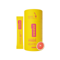 A yellow OneShot Hydrate grapefruit snap stick pack and its matching yellow cylindrical container with Arabic text and a grapefruit slice graphic, shown on a white background.