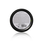 Jar of pomade with label on a white background