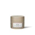 A jar of Maria Nila Clay Styling Clay in a beige color with a simple label design.