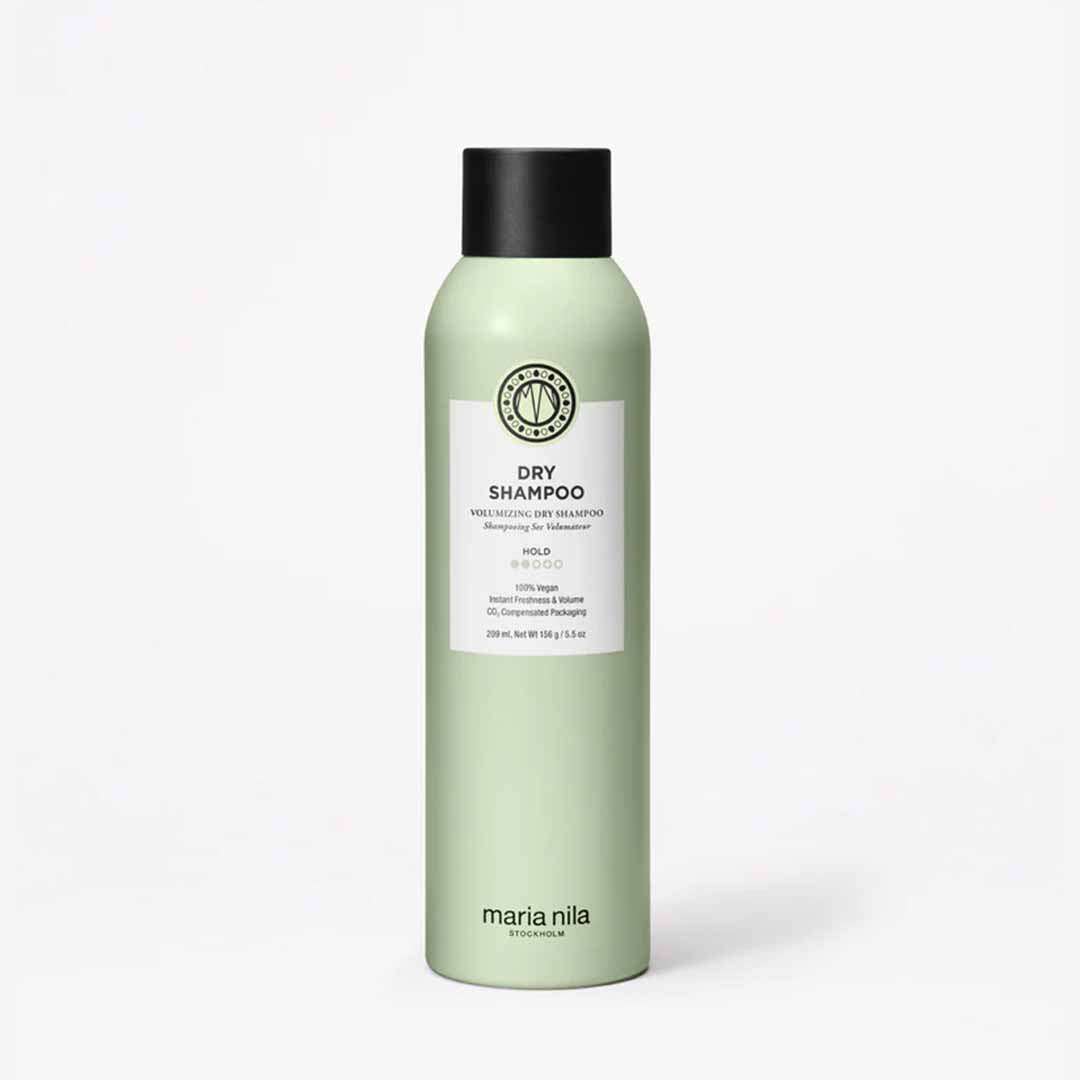 A bottle of Maria Nila Dry Shampoo, 250ml, with a green label and black cap.