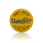 Yellow container of Dapper Dan Matt Paste on a white background