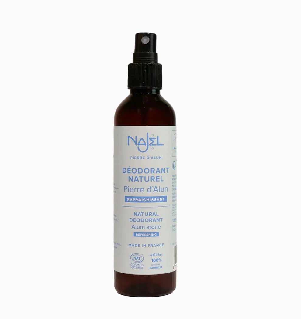 Brown spray bottle with a label on a white background