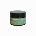 Deodorant balm jar with green label on a white background