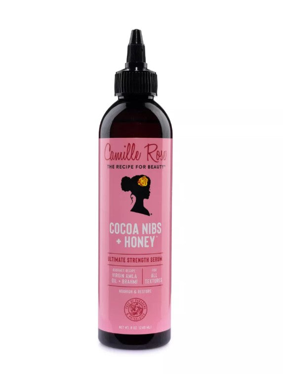 Camille Rose Cocoa Nibs + Honey serum bottle on a white background
