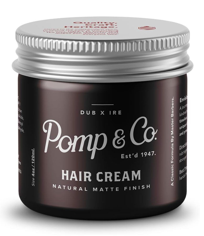 A jar of Pomp & Co. Hair Cream with a matte black label and a silver metal lid, shown on a clean white background.