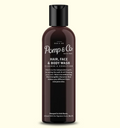 A dark brown bottle of Pomp & Co Hair, Face & Body Wash with a black cap, centered on a light cream background.