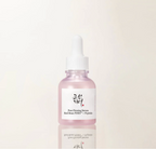 A pink glass dropper bottle of Pure Firming Serum with a white label and white dropper cap, centered on a clean off-white background with a soft reflection below.