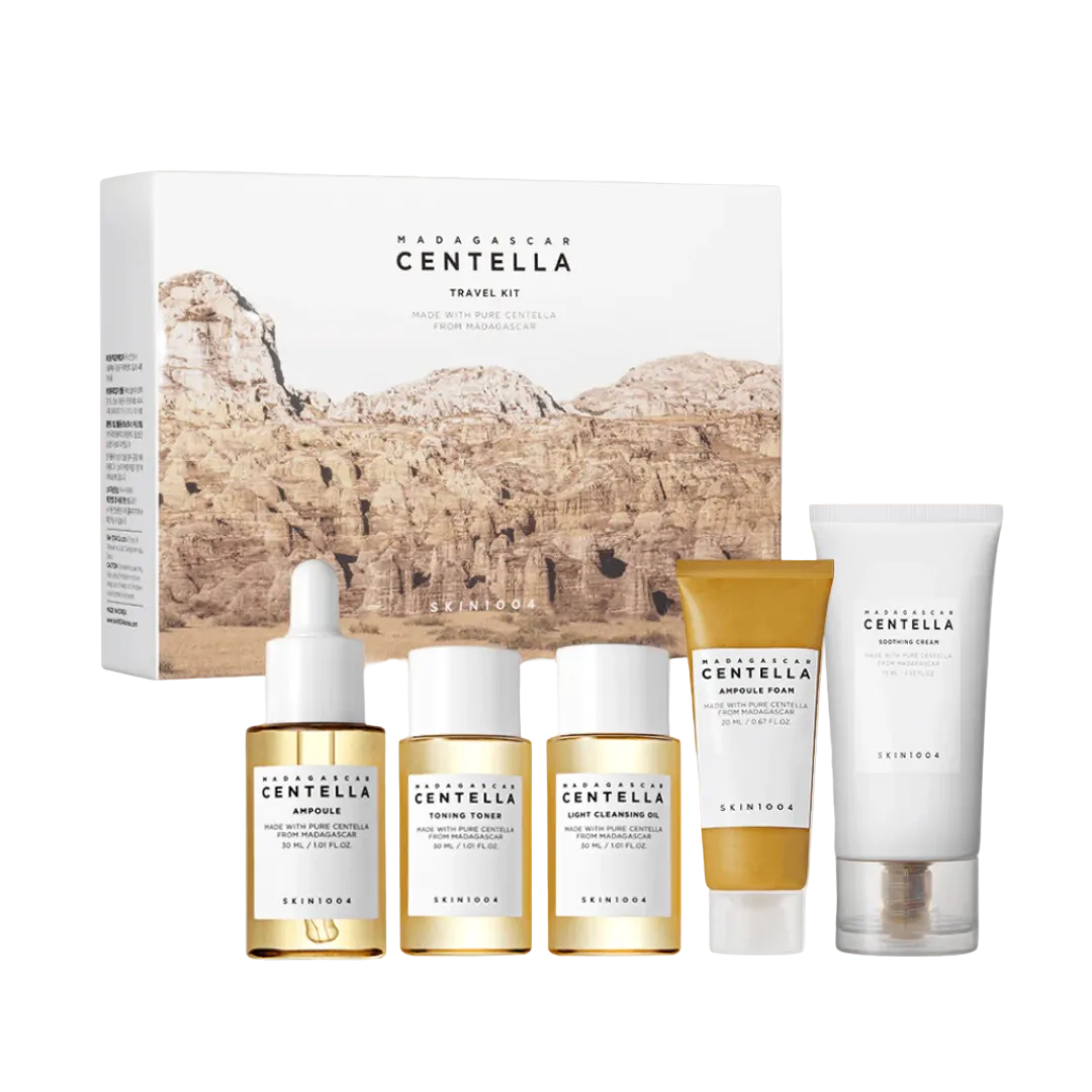 Skincare travel kit with various products and packaging on a white background