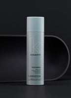Kevin Murphy hair product bottle on a dark background