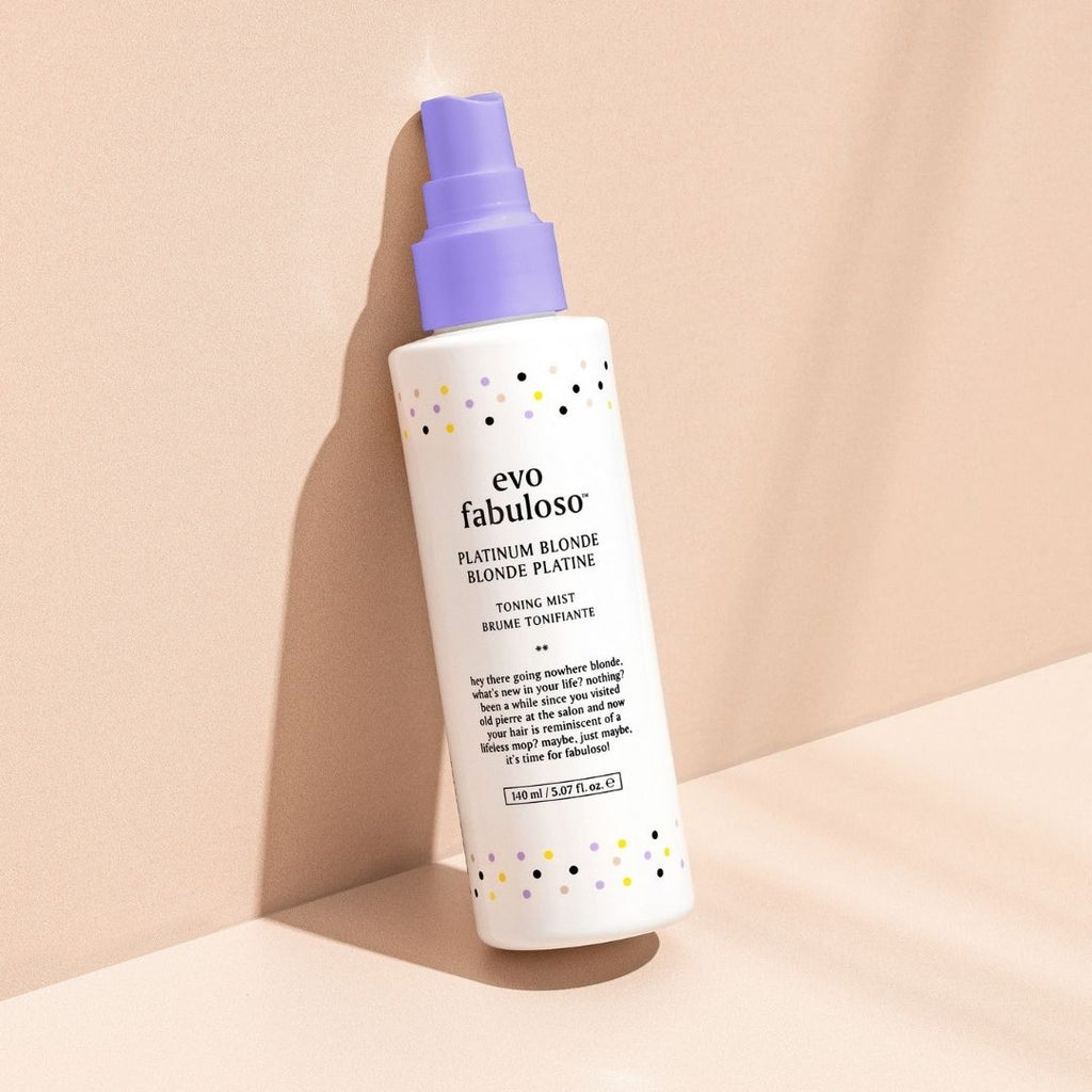 evo fabuloso hair product bottle with purple cap on a beige background