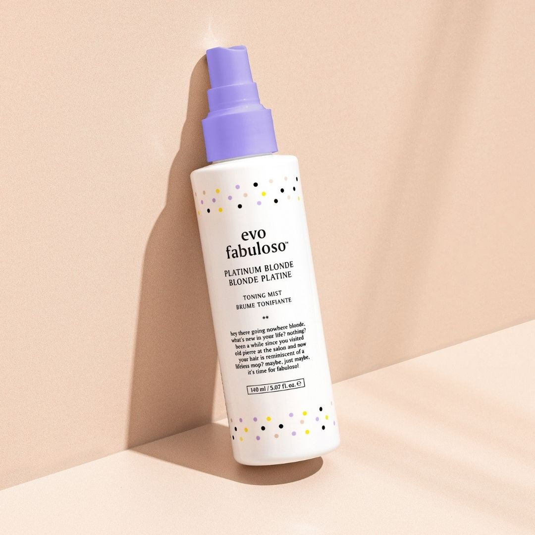 evo fabuloso hair product bottle with purple cap on a beige background