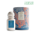 Perfume bottle and packaging with 'New!' label on a white background