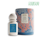 Perfume bottle and packaging with 'New!' label on a white background