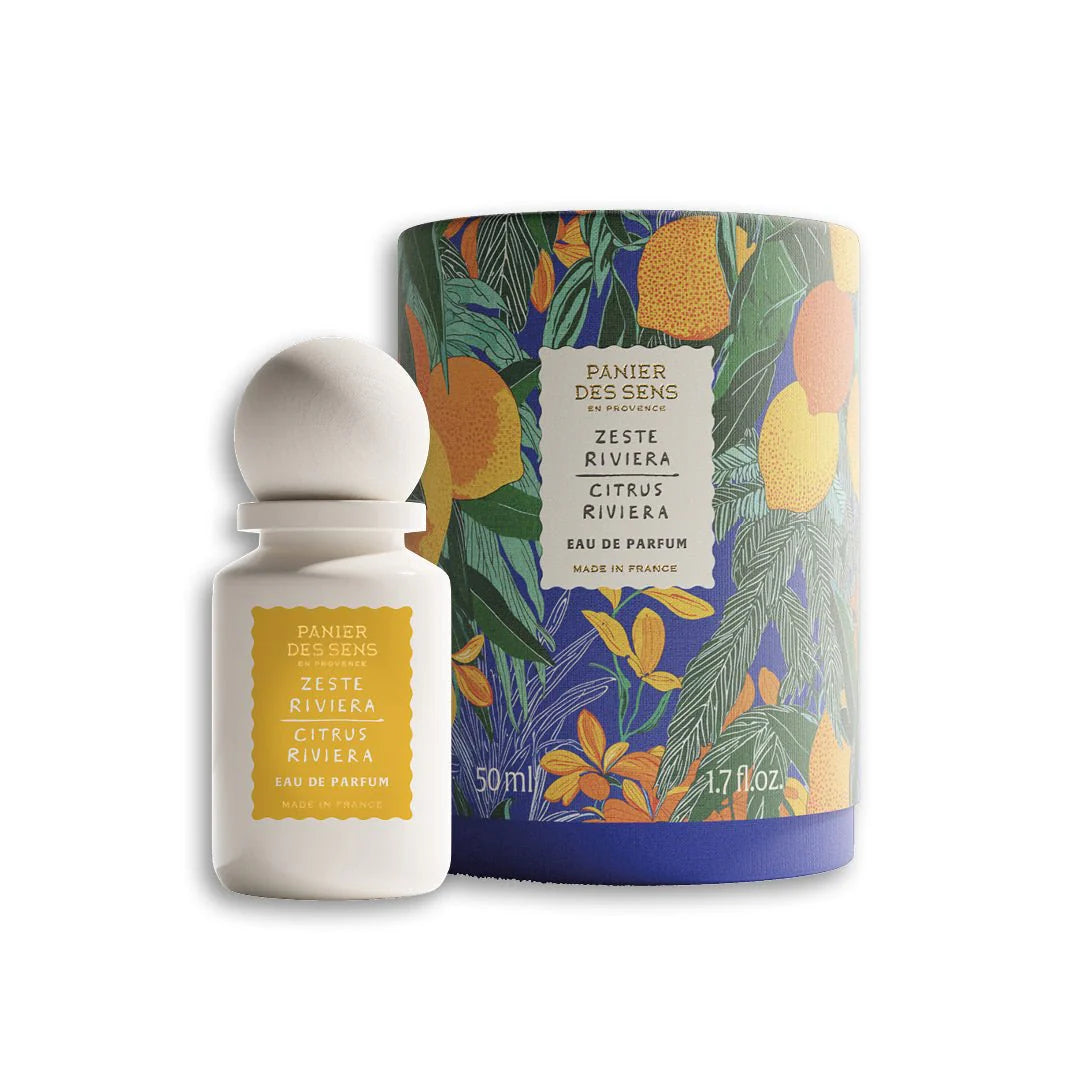 Perfume bottle and packaging with tropical design on a white background