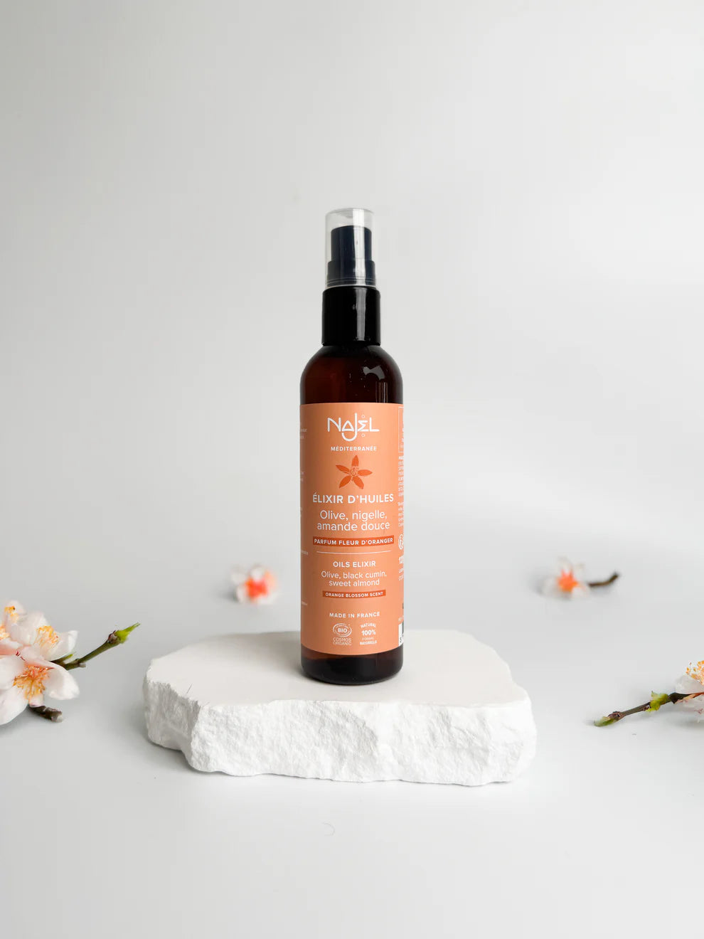Bottle of nail polish remover on a white background with floral elements