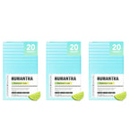 Three packages of Humantra with lime slices on a white background