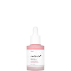 Medicube pink serum bottle on a white background