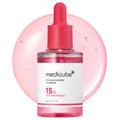 Medicube TXA Niacinamide 15% serum bottle with pink dropper on a white background