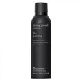 Black hair spray bottle labeled 'Living Proof' on a white background