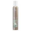 Wella EIMI hair product bottle on a white background